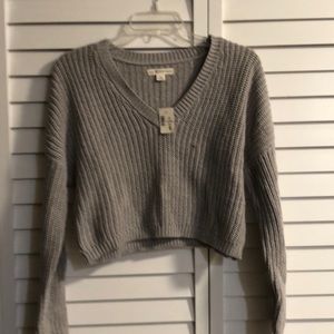 New, tags attached gray v-neck sweater